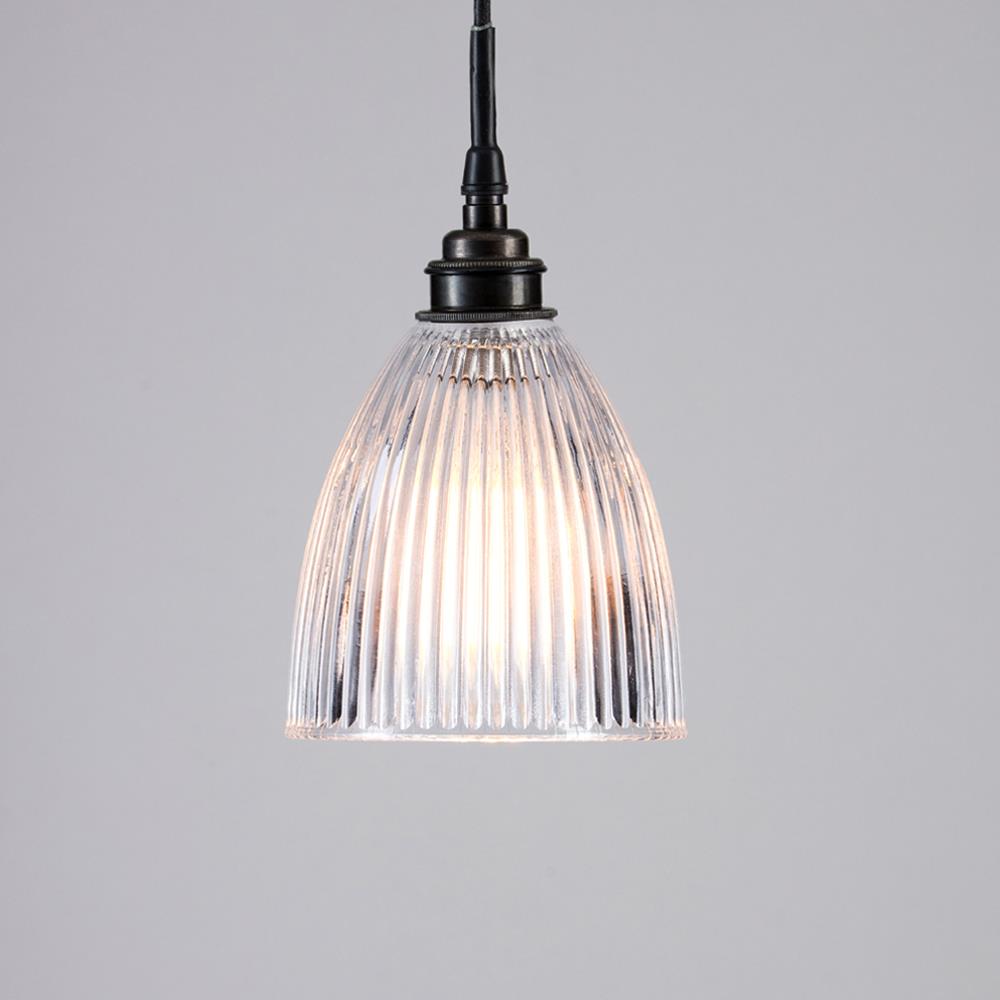 An Elongated Prismatic Bathroom Pendant Light by Old School Electric, with a clear glass shade.