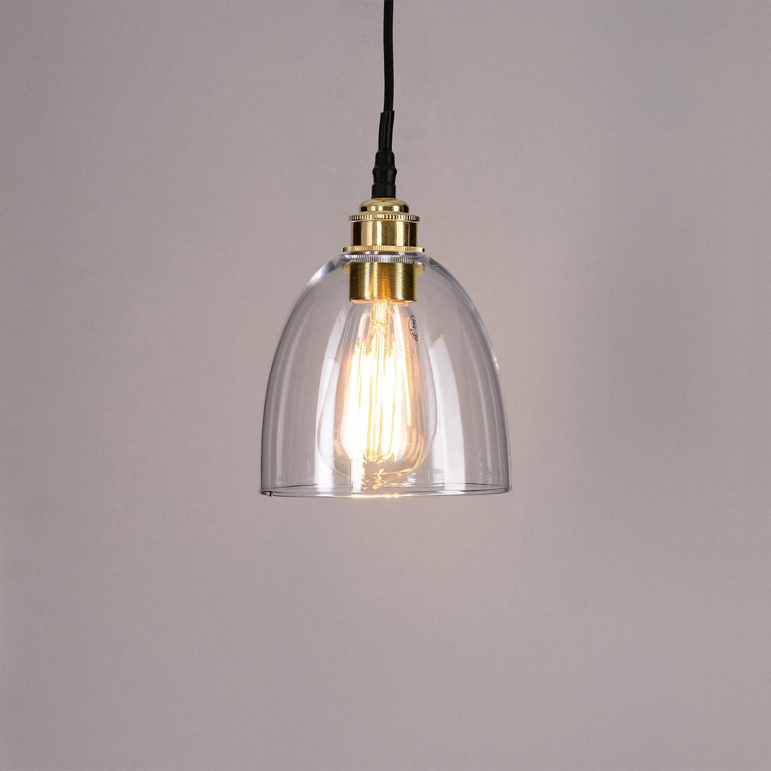 An Old School Electric Bell Blown Glass Bathroom Pendant Light, with a golden cord, perfect for adding handcrafted elegance to any bathroom.