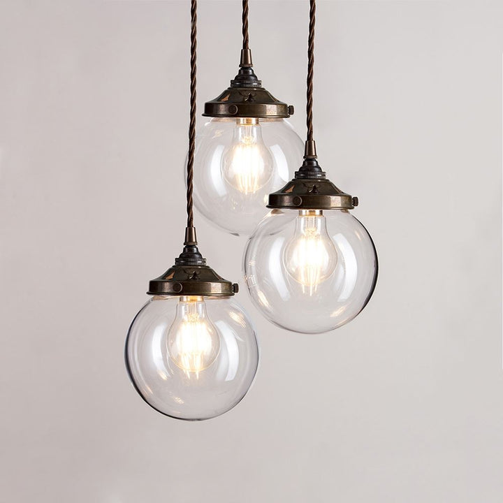 Three Old School Electric Blown Clear Glass Cluster Pendant Light fixtures hanging from a chain.