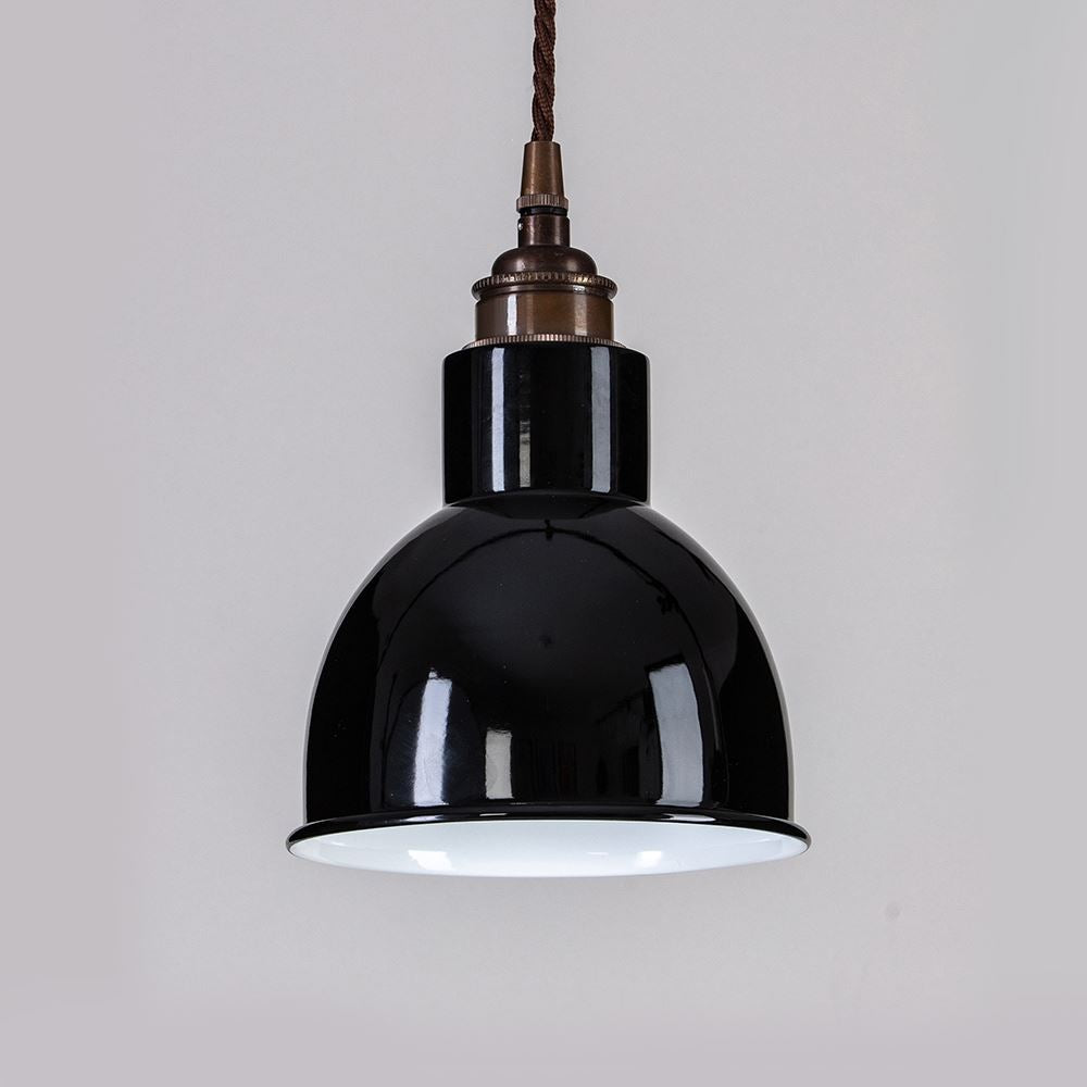 An Old School Electric Churchill Coloured Shades Pendant Light hanging on a wall.