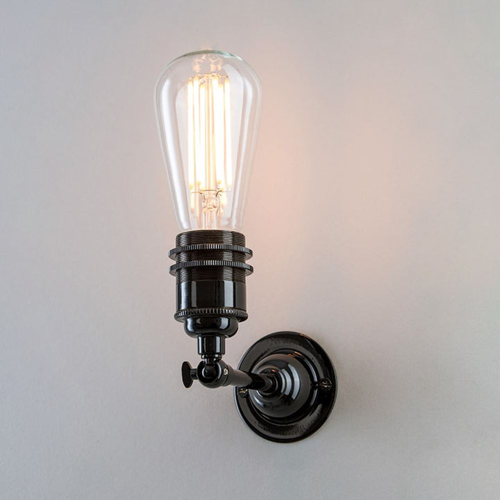 An Old School Electric Industrial Wall Light with a light fitting.