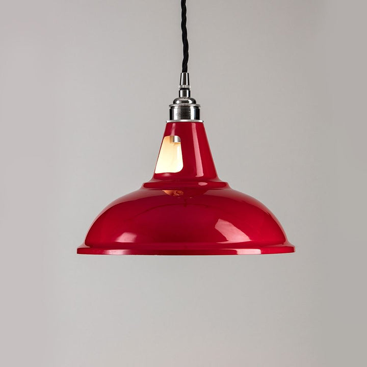 An Old School Electric Factory Pendant Light fitting hanging on a white wall.