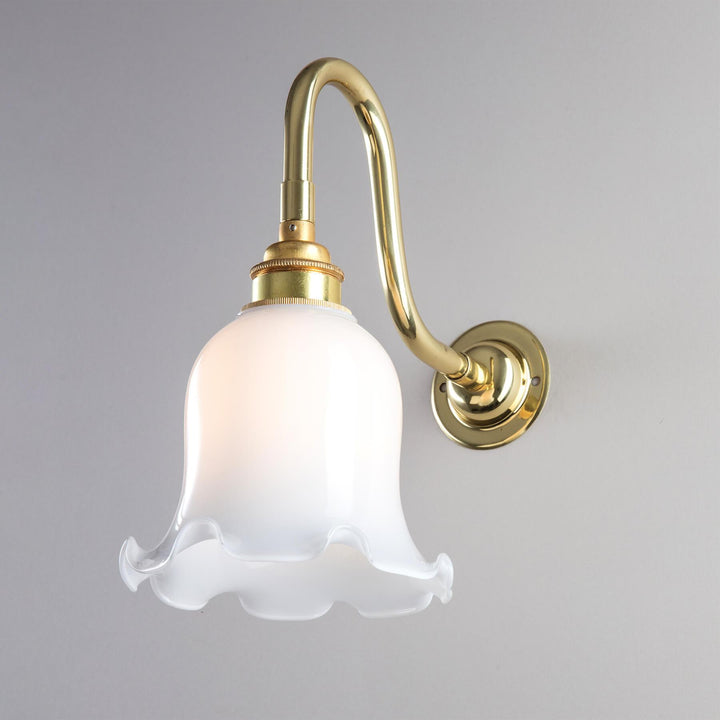 An Old School Electric Tulip Opal Glass Bathroom Wall Light, perfect for lighting fixtures and adding an elegant touch to any space.