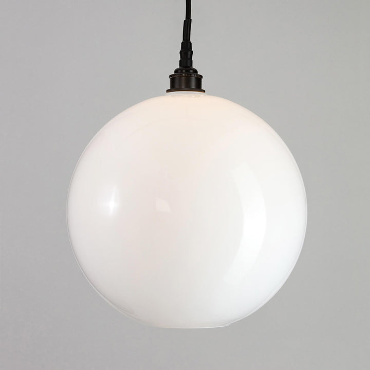 An Adderley Bathroom Pendant Light from Old School Electric, with a black cord.