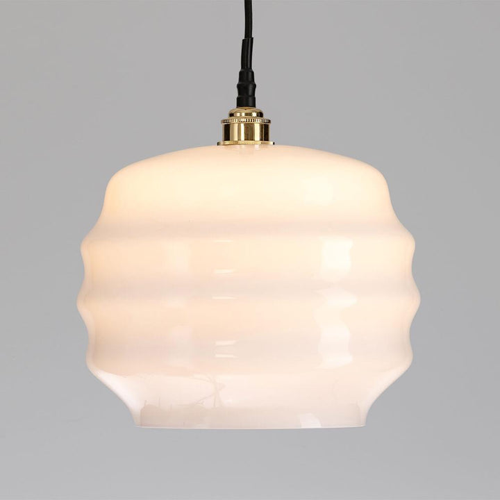 An Old School Electric Deco Bathroom Pendant Light with a white glass shade.