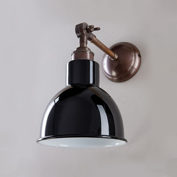 An Old School Electric Churchill Coloured Shades Wall Light with a black shade. This light fitting features a sleek design and is perfect for adding a touch of elegance to any space.