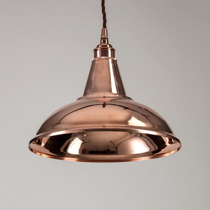 An Old School Electric Factory Pendant Light fitting hanging from a ceiling.