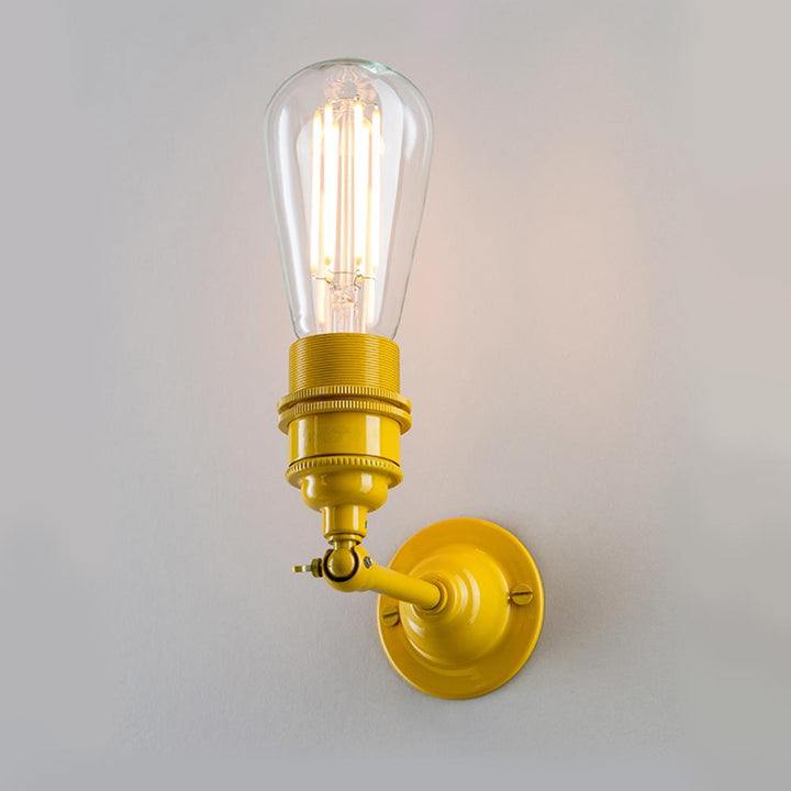 An Old School Electric Industrial Wall Light on a white wall.
