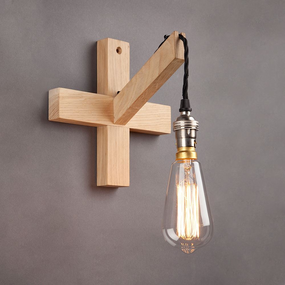 An elegant Oak Bulb Wall Light adorned with Old School Electric lights hangs gracefully on a wall.