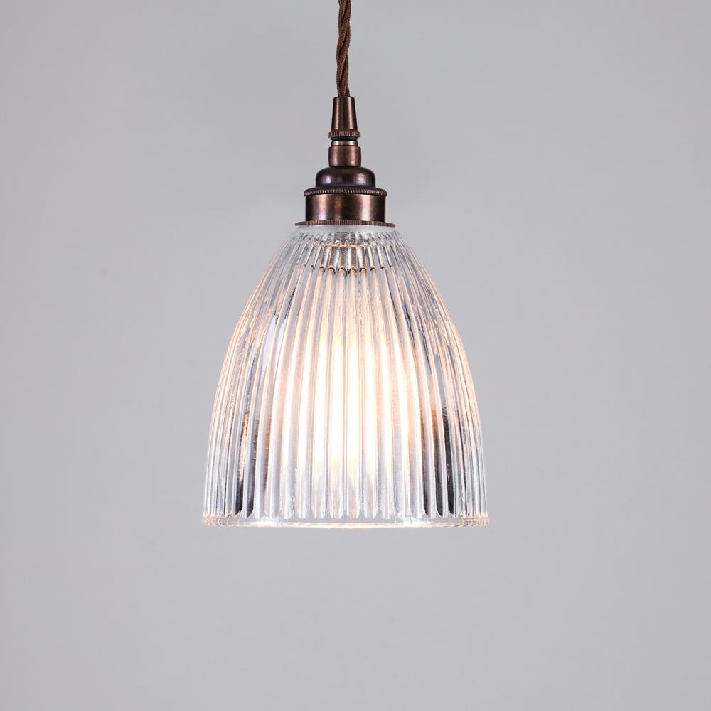An Old School Electric Elongated Prismatic Pendant Light from a ceiling, providing elegant lighting.