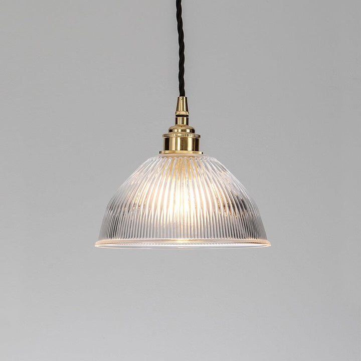 An Old School Electric Prismatic Dome Pendant Light from a ceiling.