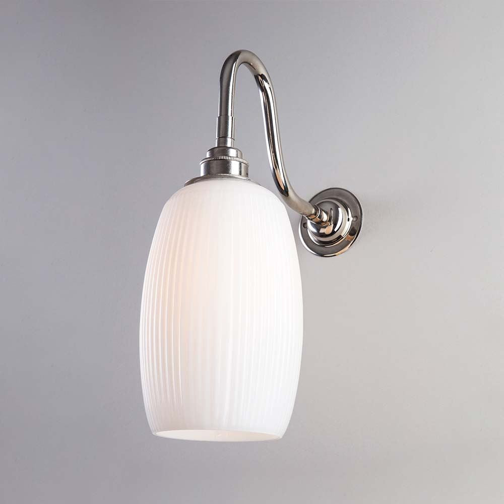 An Old School Electric Gillespie Wall Light with a white glass shade.