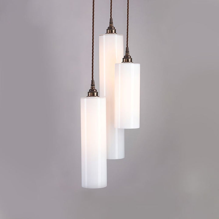 Three Old School Electric Parker Cluster Pendant Lights hanging on a gray background.