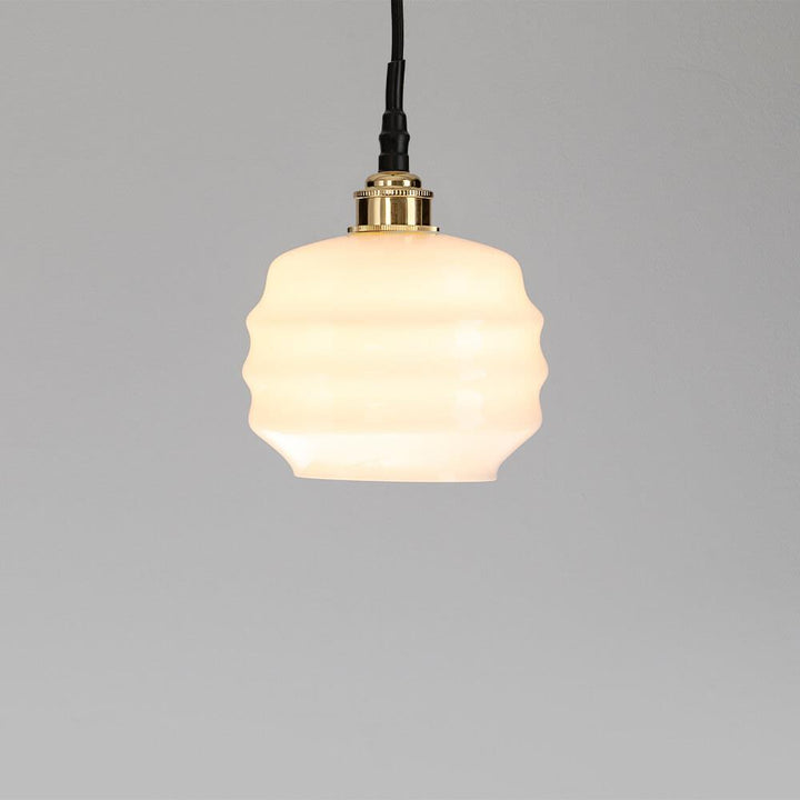 The Old School Electric Deco Bathroom Pendant Light with a white glass shade. This lighting fixture illuminates spaces with its elegant design and bright light.