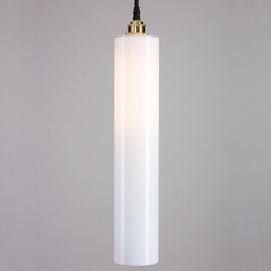 A Parker Bathroom Pendant Light by Old School Electric, with a gold cord, perfect for enhancing any space with its elegantly designed light fitting.