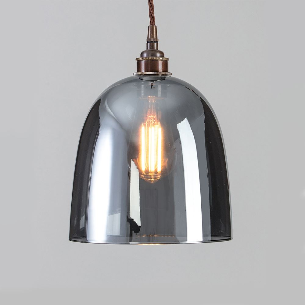 An Old School Electric Bell Blown Smoked Glass Pendant Light with a grey glass shade.