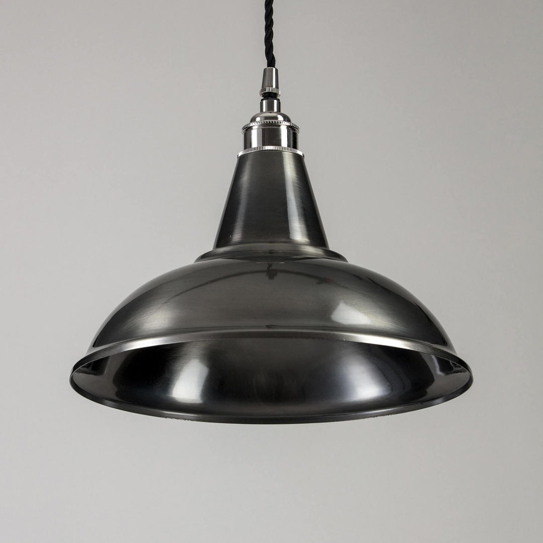 An Old School Electric Factory Pendant Light, a lighting fixture, hanging from a ceiling.