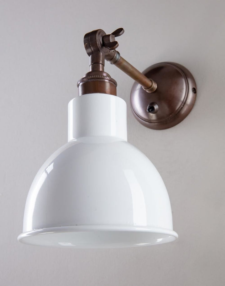 An Old School Electric Churchill Coloured Shades Wall Light with an electric light.