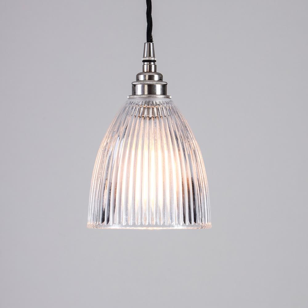 An Elongated Prismatic Pendant Light from Old School Electric hung from the ceiling.