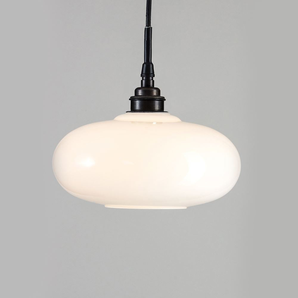An Old School Electric Montgomery Pendant Light with a black shade, perfect for illuminating any space.