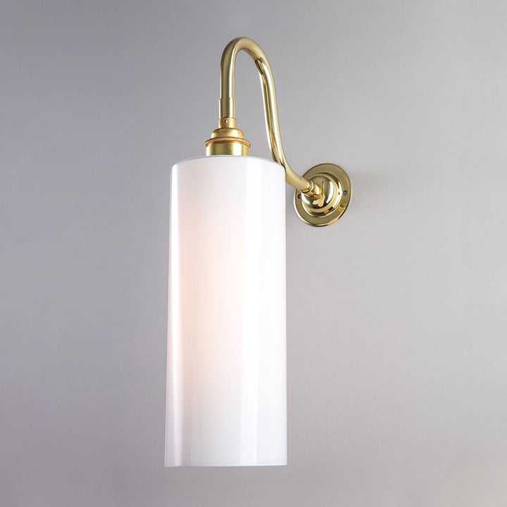 A Parker Wall Light by Old School Electric, with a white glass shade, perfect for lighting fixtures.
