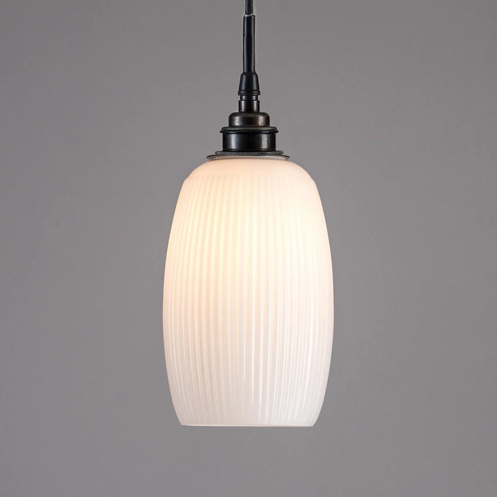 An Old School Electric Gillespie Bathroom Pendant Light with a white glass shade, perfect for lighting fixtures.