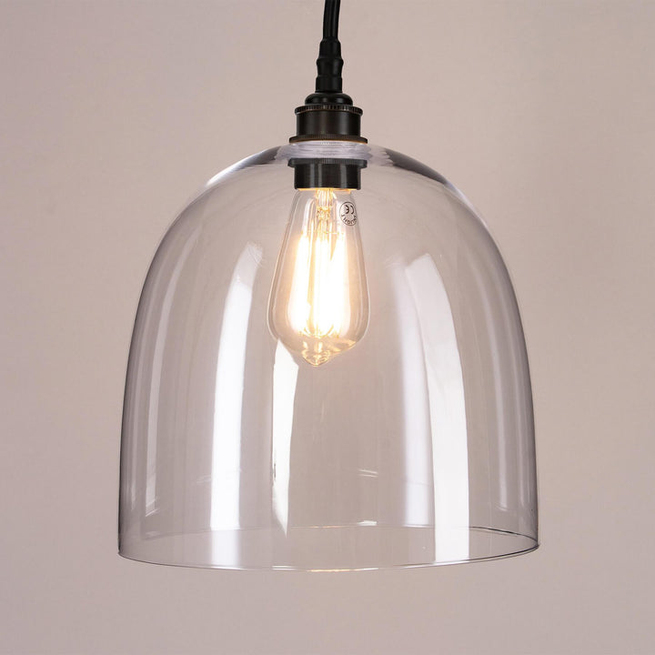 An Old School Electric Bell Blown Glass Bathroom Pendant Light with a black cord, perfect for lighting fixtures.