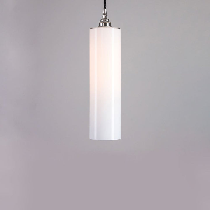 An Old School Electric Parker Pendant Light with a white shade. This electric lighting fixture enhances the ambiance with its soft and elegant glow.
