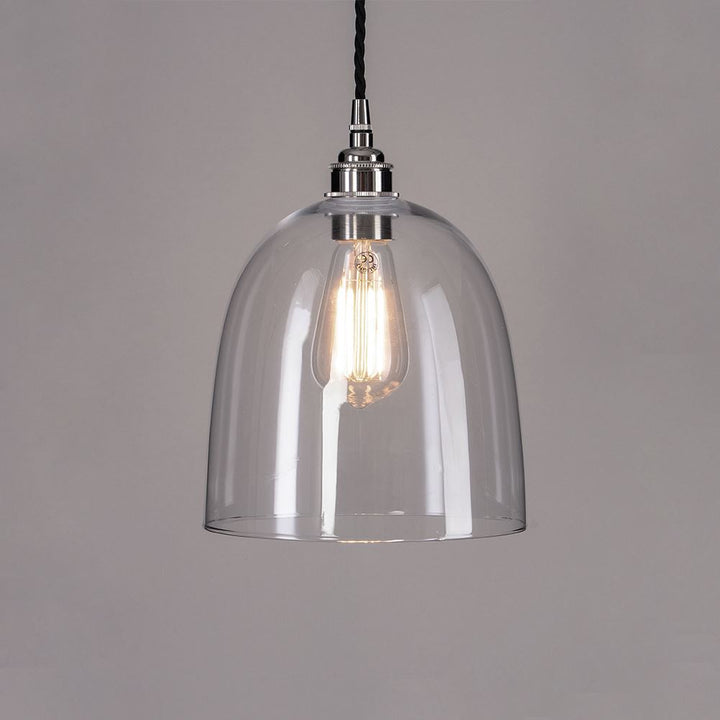 A Bell Blown Glass Pendant Light with a black cord, branded by Old School Electric, that elegantly illuminates any space.