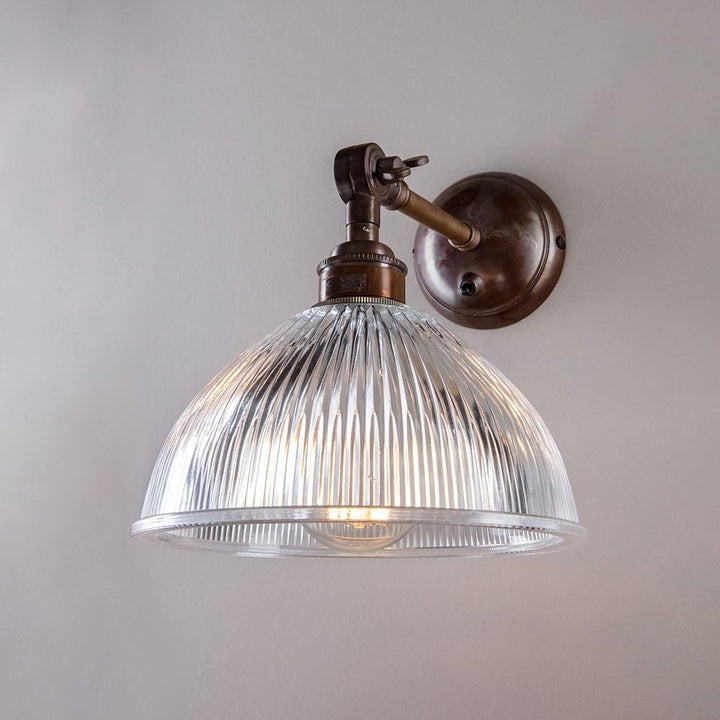 An Old School Electric Prismatic Adjustable Arm Dome Wall Light.