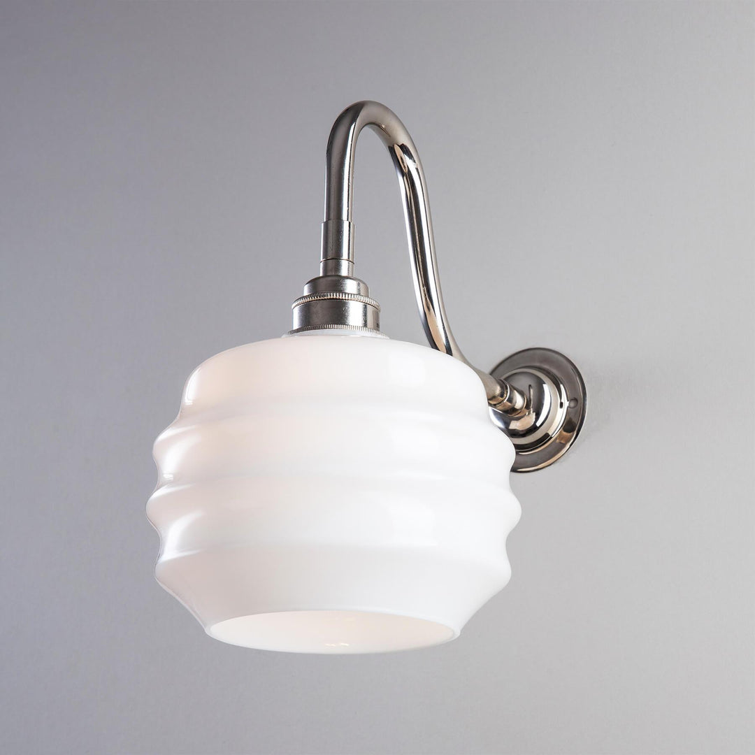 An Old School Electric Deco Opal Glass Bathroom Wall Light with a white glass shade.