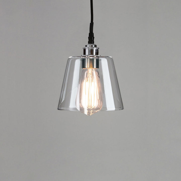 An Old School Electric Tapered Blown Glass Bathroom Pendant Light with a black cord, perfect for any lighting fixtures.