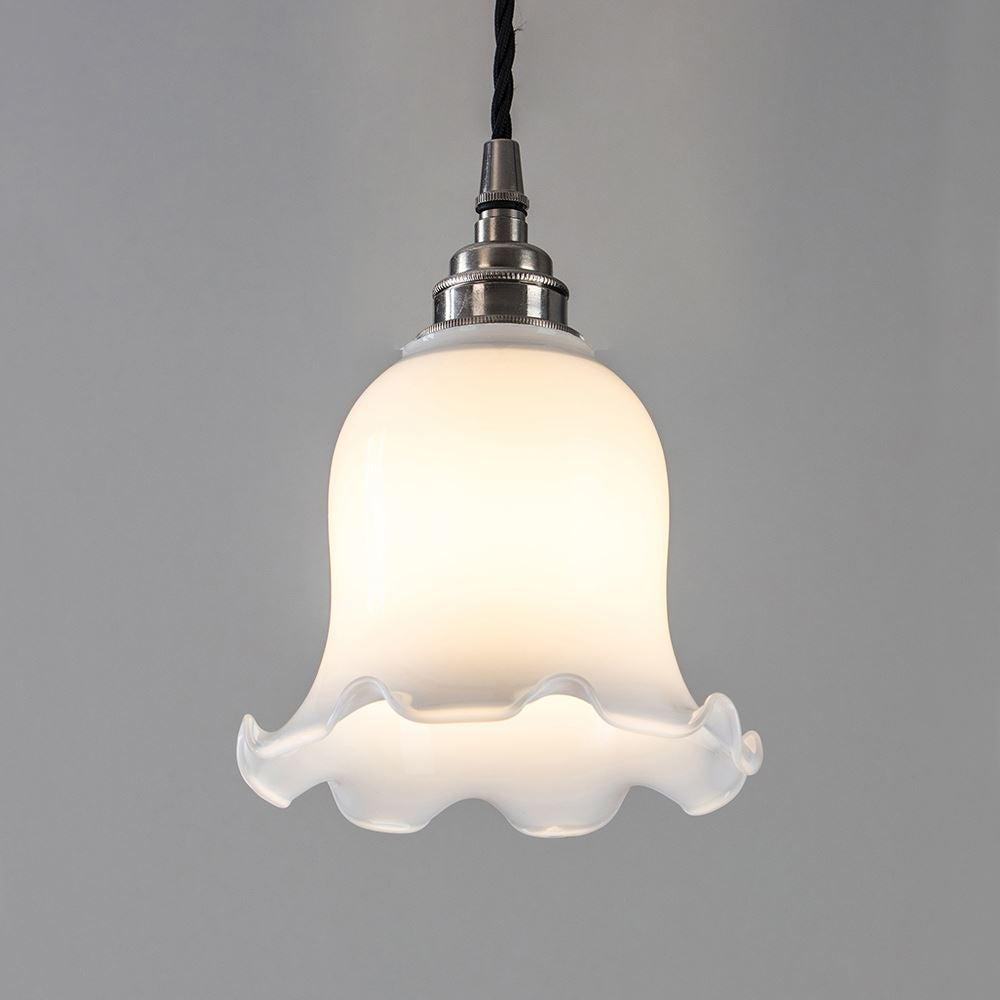 An Old School Electric Tulip Opal Glass Pendant Light with a white flower on it, serving as an elegant electric lighting fixture.
