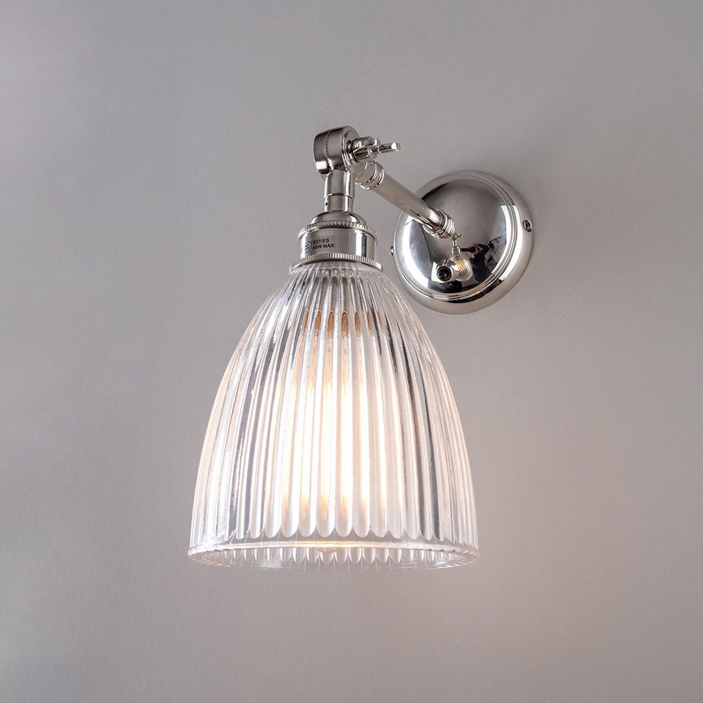 An Elongated Prismatic Adjustable Arm Wall Light with a clear glass shade, perfect for elegant lighting fixtures, made by Old School Electric.