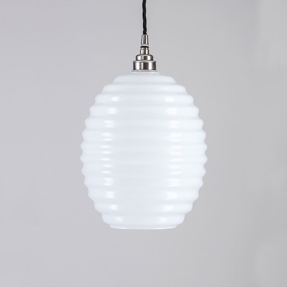 A white Beehive Pendant Light from Old School Electric hanging from a metal chain.
