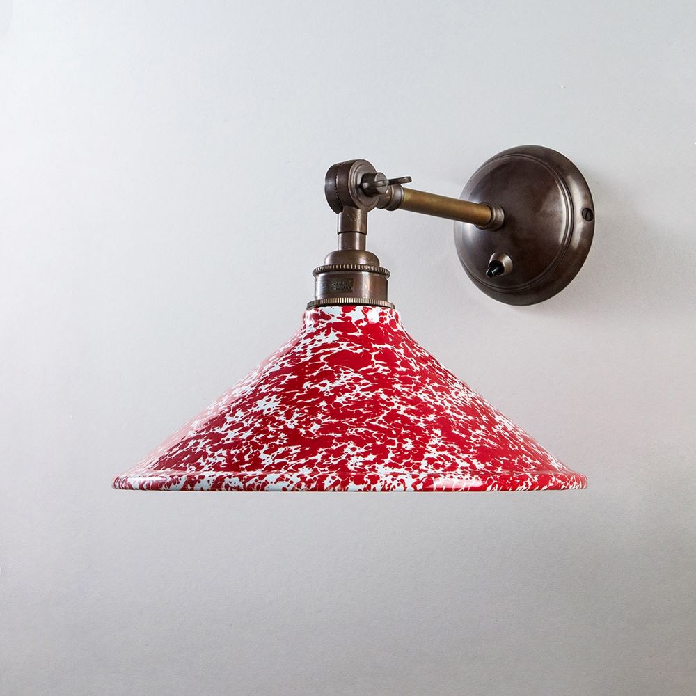 An Old School Electric Splatter Wear Shade Adjustable Arm Wall Light on a wall.