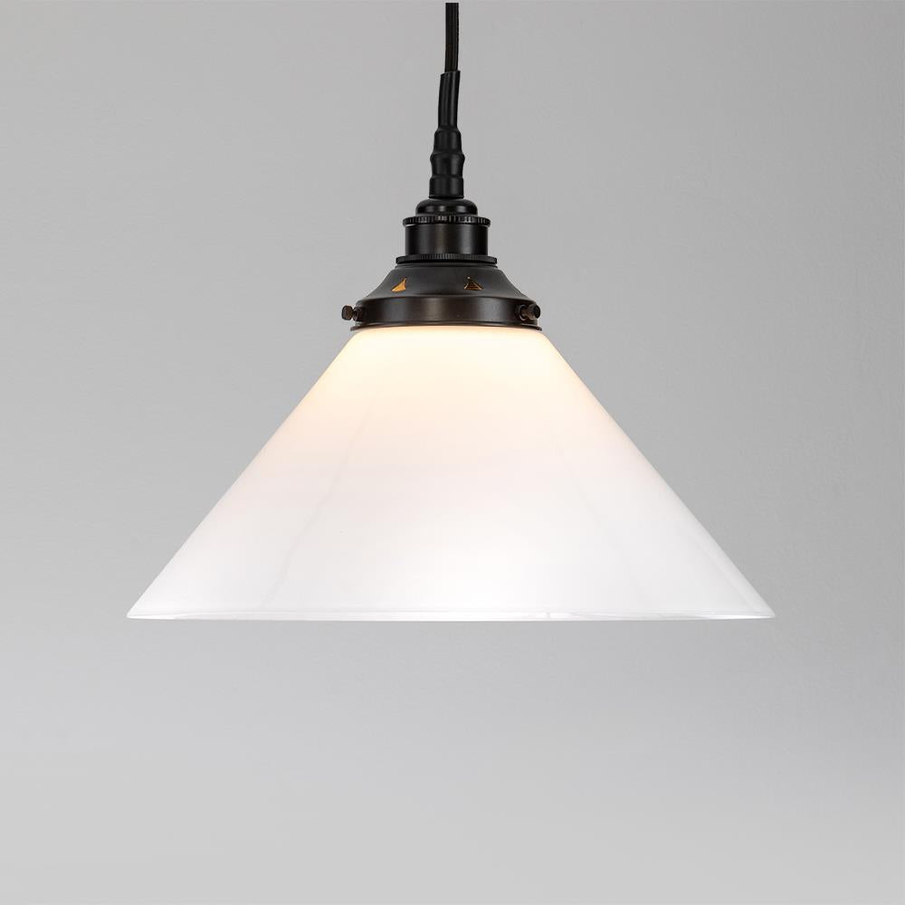 An Old School Electric Conical Opal Glass Bathroom Pendant Light with a white glass shade.