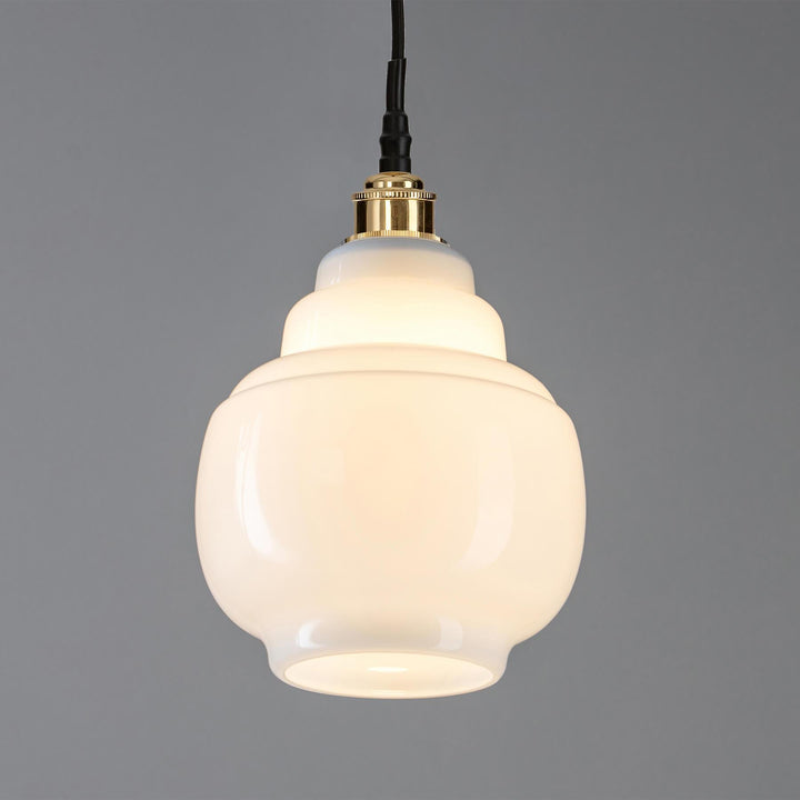 An Old School Electric Barrel Opal Glass Bathroom Pendant Light with a gold finish.