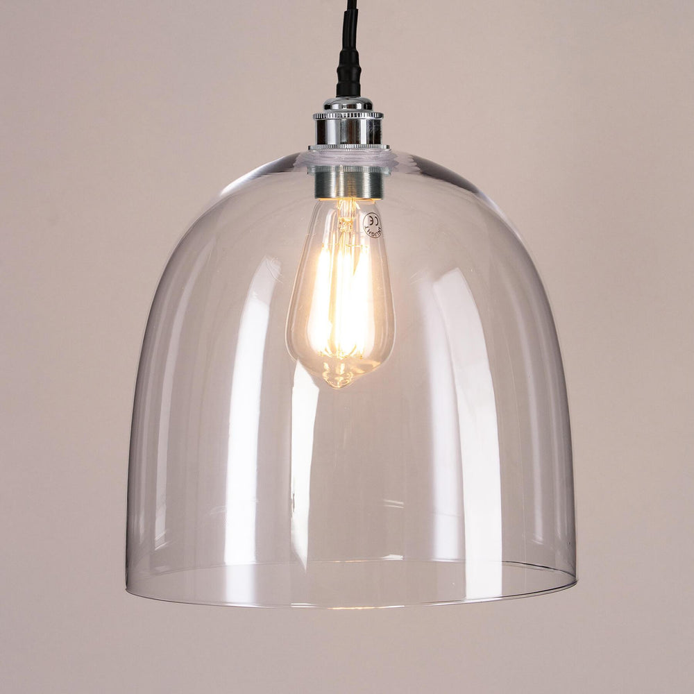 An Old School Electric Bell Blown Glass Bathroom Pendant Light, with a clear glass shade, exuding handcrafted elegance for any space, be it a bathroom or beyond.