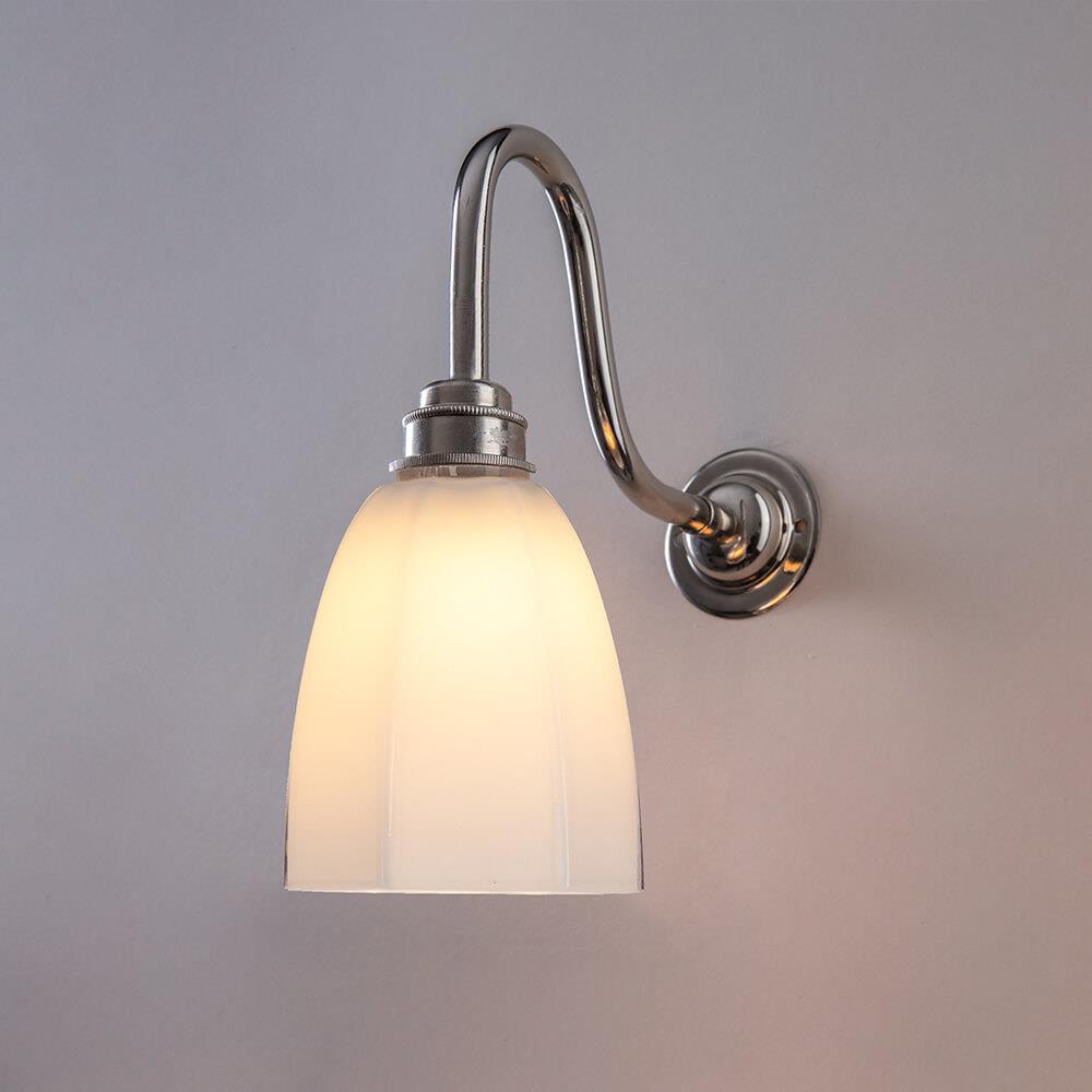 An Old School Electric Hexagon Swan Wall Light with a white glass shade.