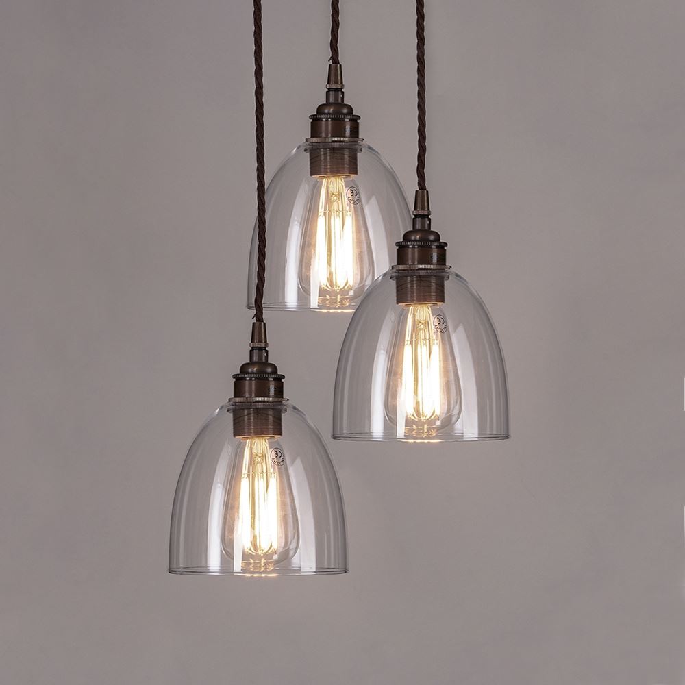 Three Old School Electric Blown Clear Glass Cluster Pendant Lights hanging on a chain.