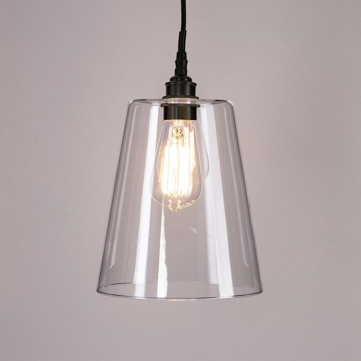 An Old School Electric Tapered Blown Glass Bathroom Pendant Light with an old bulb.