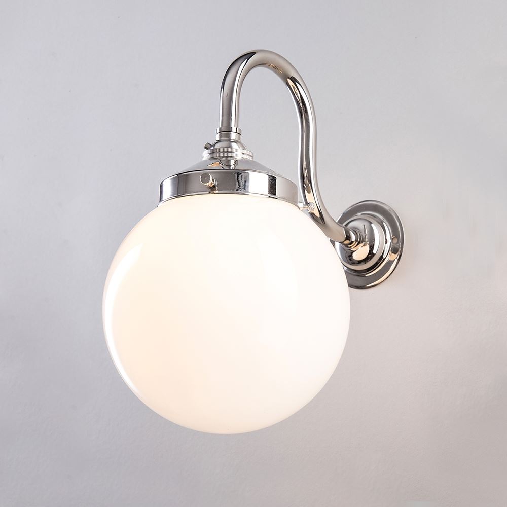 This Opal Globe Bathroom Wall Light by Old School Electric features a white globe, perfect for illuminating any space.