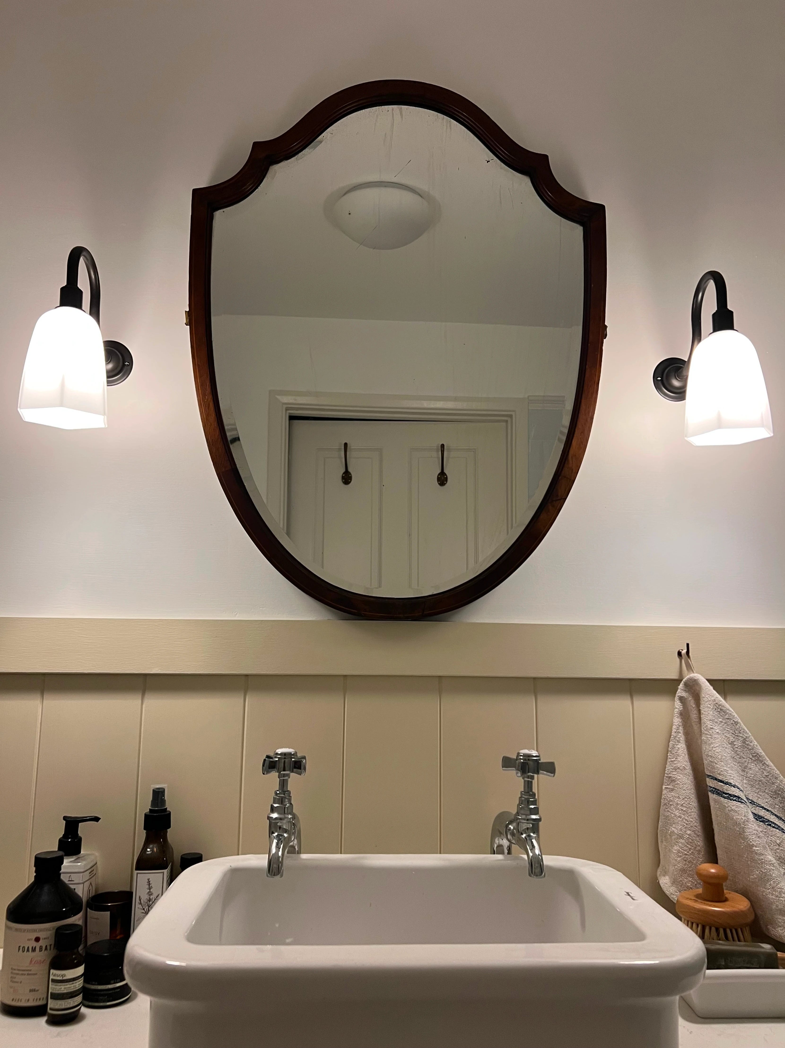 A mirror above a sink.